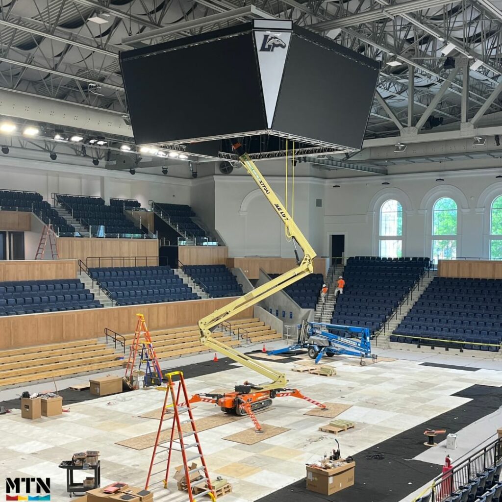 Scoreboard being raised 